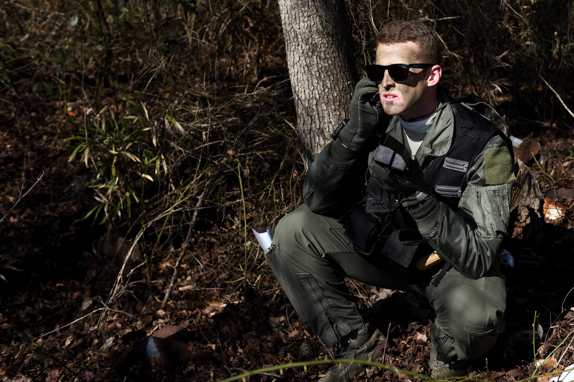 U.S. Air Force Capt. Steve Keck, 336th Fighter Squadron pilot, attempts to establish communications with a rescue team during a tactical recovery of aircraft and personnel exercise, Jan. 31, 2017, in Kinston, North Carolina. The joint-service exercise combined U.S. Air Force and U.S. Marine Corps assets to rescue a simulated downed aircrew behind enemy lines. (U.S. Air Force photo by Airman Miranda A. Loera)