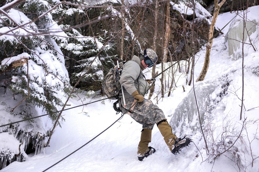 An Army National Guard soldier rappels down the side of a mountain at Smugglers' Notch in Jeffersonville, Vt., Jan. 28, 2017. Air National Guard photo by Tech. Sgt. Sarah Mattison