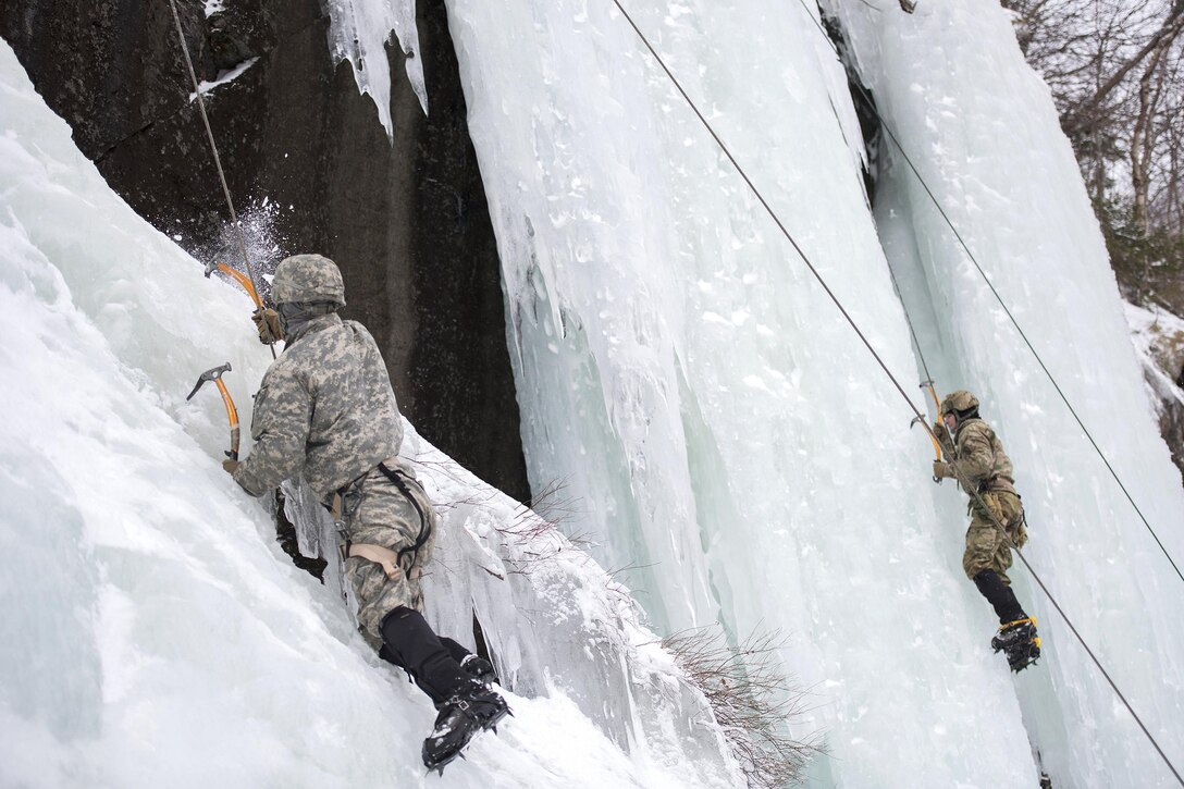 Army National Guard Soldiers climb an ice-covered cliff at Smugglers' Notch in Jeffersonville, Vt., Jan. 28, 2017. Air National Guard photo by Tech. Sgt. Sarah Mattison