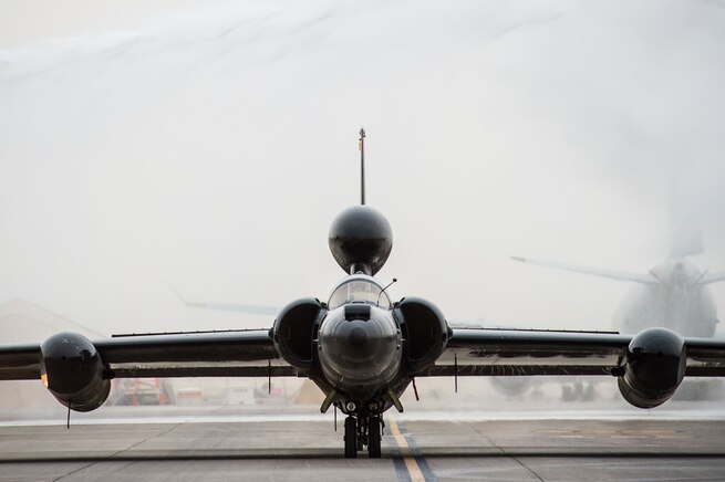 A U-2 taxis through a ceremonial shower after completing 30,000 flight hours at an undisclosed location in Southwest Asia, Feb. 2, 2017. Firetrucks parked on either side of the U-2 and discharged water for the ceremony. The milestone marks the second U-2 in the Air Force fleet to reach the historic milestone. (U.S. Air Force photo/Senior Airman Tyler Woodward)