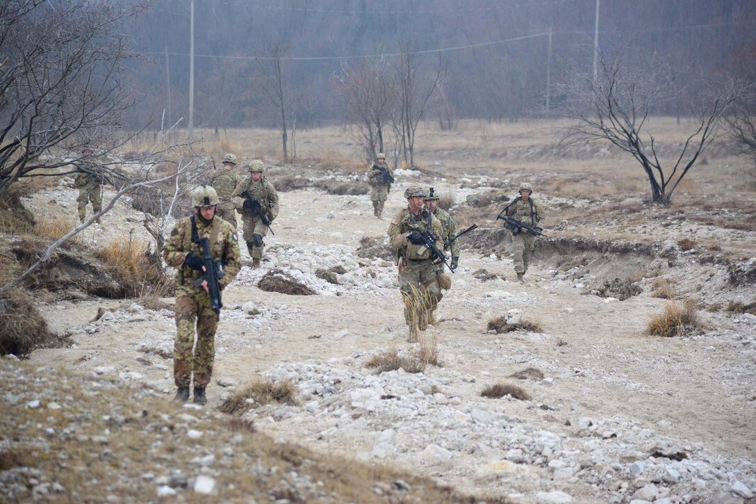 U.S. Army paratroopers and Italian army troops with the 8th Regiment Alpine train together at the Rivoli Bianchi range in Venzone Italy, Feb. 2, 2017. The 173rd Airborne Brigade is the Army Contingency Response Force in Europe, capable of projecting ready forces anywhere in the U.S., European, Africa or Central Commands' areas of responsibility within 18 hours. Army photo by Graigg Faggionato