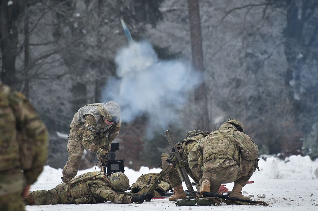 Soldiers conduct a mortar live-fire exercise at the 7th Army Training Command's Grafenwoehr Training Area, Germany, Jan. 24, 2017. The soldiers are preparing to support Operation Atlantic Resolve later this year. Army photo by Gertrude Zach