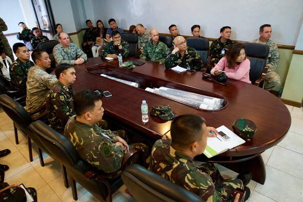 A group of U.S. and Philippine Air Force service members pose for a group photo after concluding a two-week Subject Matter Expert Exchange, Clark Air Base, Philippines, Jan. 25, 2017. Throughout the SMEE military members from both nations trained together using satellite imagery provided by Eagle Vision to enhance their combined readiness when conducting Humanitarian Assistance and Disaster Relief operations common in the Asia-Pacific. (U.S. Air Force photo by Tech. Sgt. James Stewart/Released)