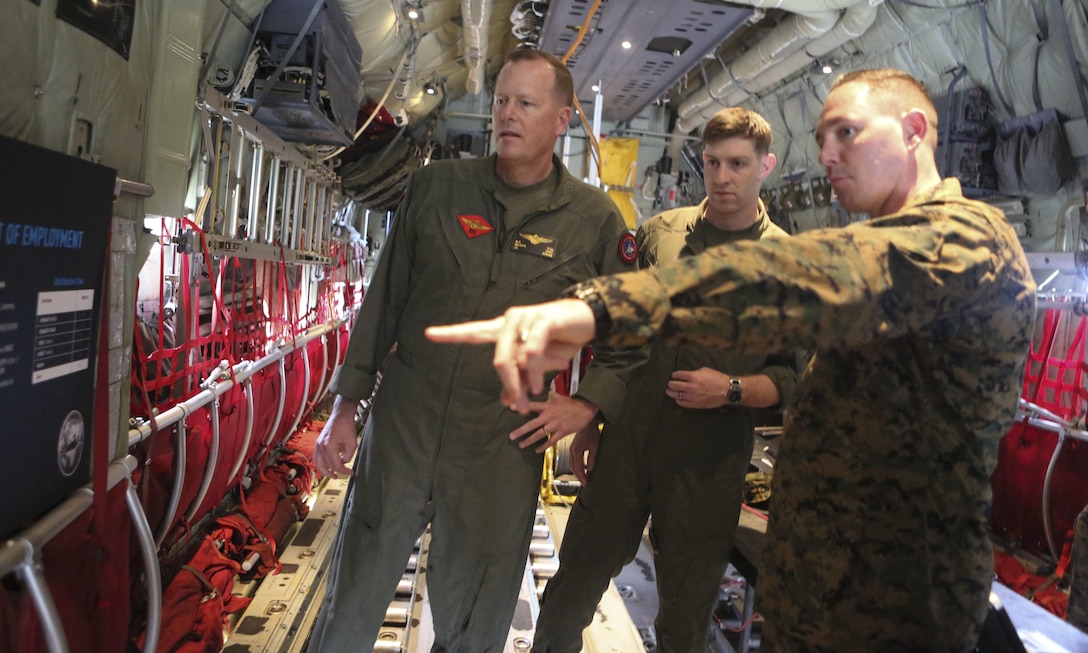 Master Sgt. Michael A. Moore, 3rd Marine Aircraft Wing G-6, technical control engineer, explains future plans for the Hatch Mounted SATCOM (Satellite Communication) Antenna System (HMSAS) to the commanding general of 3rd MAW, Maj. Gen. Mark Wise, aboard Marine Corps Air Station Miramar, Calif., Jan. 9. The HMSAS was developed for pre-deployment training in order to enhance communications for raid force and tactical recovery of aircraft and personnel (TRAP) missions, in preparation to support a Special Purpose Marine Air-Ground Task Force (SPMAGTF). (U.S. Marine Corps photo by Cpl. Harley Robinson/Released)