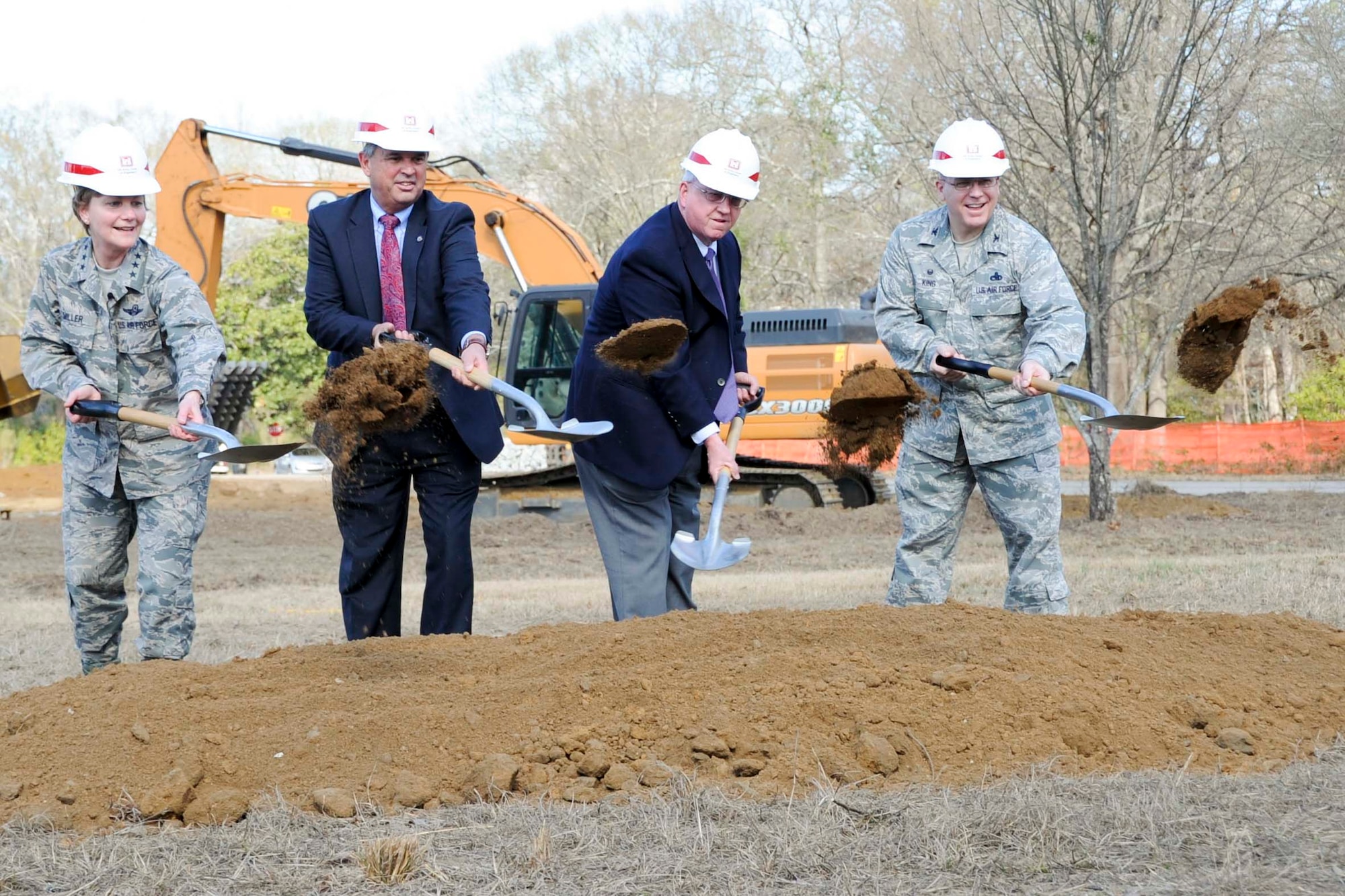 From left, Lt. Gen. Maryanne Miller, Air Force Reserve Command commander, Randy Toms, Warner Robins mayor, Tommy Stalnaker, Houston County commissioner and Col. Jeffrey King, 78th Air Base Wing commander, break ground during a ground-breaking ceremony at Robins Air Force Base, Ga, Feb. 2, 2017. The new AFRC consolidated mission complex is expected to be completed in 2019. (U.S. Air Force photo by Staff Sgt. Ciara Gosier) 