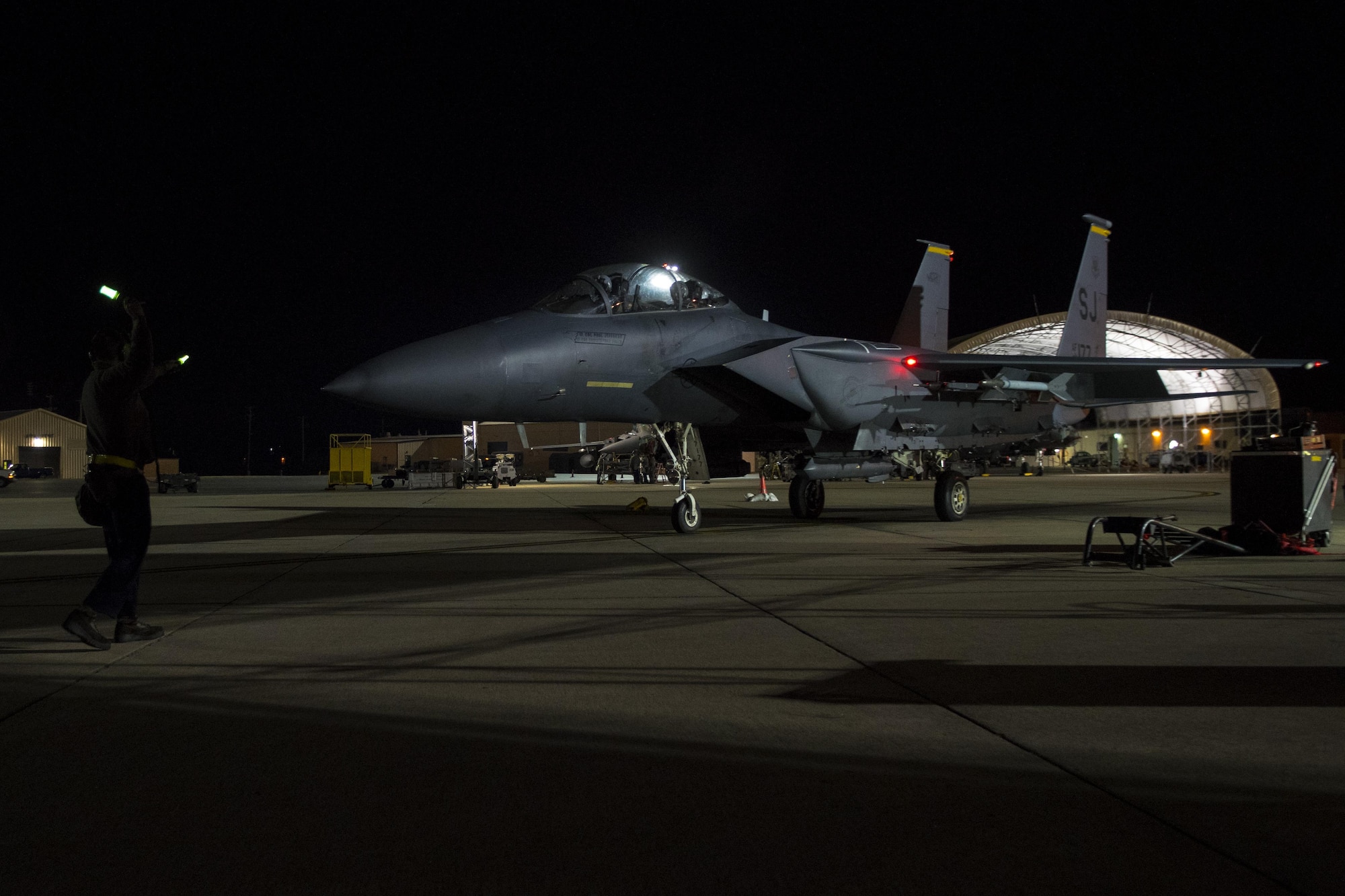 Senior Airman Joshua Sprinkle, 4th Aircraft Maintenance Squadron crew chief, marshals an F-15E Strike Eagle assigned to the 336th Fighter Squadron during exercise Coronet Warrior 17-01, Jan. 31, 2017, at Seymour Johnson Air Force Base, North Carolina. More than 138 aircraft launched during the exercise which tested Team Seymour’s ability to successfully operate in a simulated hostile environment reflecting our current area of responsibility. (U.S. Air Force photo by Airman Shawna L. Keyes)