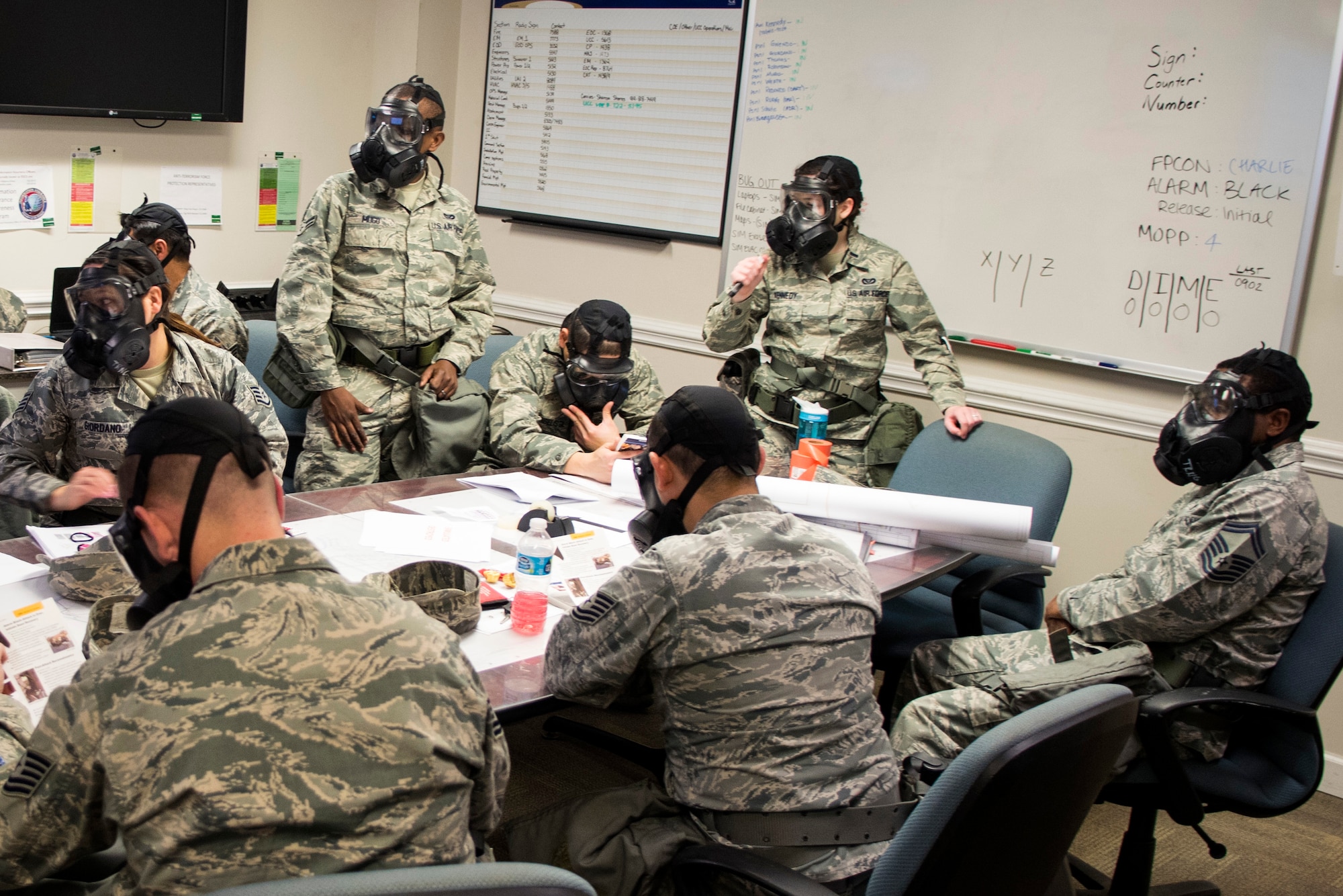 Airmen from the 4th Civil Engineer Squadron review Airman’s Manuals for proper procedures concerning attacks during exercise Coronet Warrior 17-01, Jan. 30, 2017, at Seymour Johnson Air Force Base, North Carolina. The expeditionary exercise was conducted to keep Airmen’s skills sharp for overseas contingency operations. (U.S. Air Force photo by Airman Shawna L. Keyes)