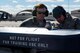 Senior Airman Ashton Hardin (left), 4th Aircraft Maintenance Squadron weapons load crew member, and Staff Sgt. Angel Dearce, 4th AMXS weapons load crew chief, inspect munitions before loading them onto an aircraft during exercise Coronet Warrior 17-01, Jan. 30, 2017, at Seymour Johnson Air Force Base, North Carolina. Weapons Airmen fully loaded an F-15E Strike Eagle to simulate deployed working conditions. (U.S. Air Force photo by Airman Shawna L. Keyes)