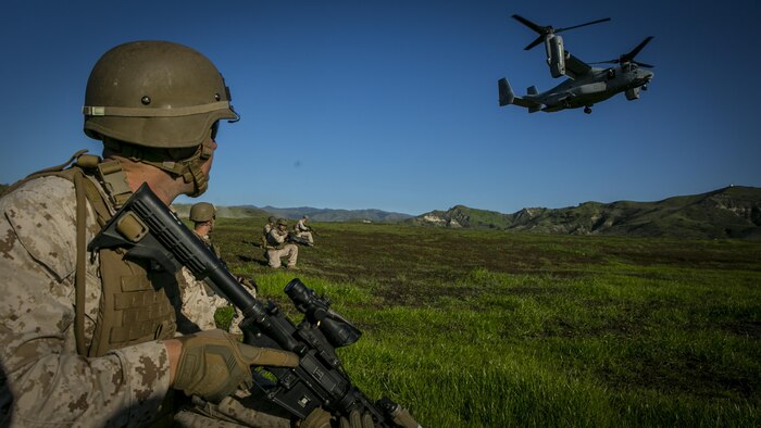 MARINE CORPS BASE CAMP PENDLETON, Calif. – Marines with the 15th Marine Expeditionary Unit's Maritime Raid Force post security for an MV-22 Osprey to land safely during integrated operational exercise at Camp Pendleton, Jan. 30, 2017. The Marines learned the proper procedures to post security for the aircraft and board it properly during training operations designed to mold separate elements of the MRF into a seamless fighting force. (U.S. Marine Corps photo by Lance Cpl. Frank Cordoba) 