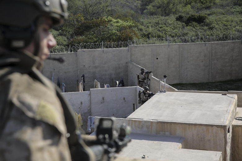 MARINE CORPS BASE CAMP PENDLETON, Calif. – Marines with the 15th Marine Expeditionary Unit Maritime Raid Force provide security on a target building during an Interoperability Exercise on Camp Pendleton, Jan. 30, 2017. Throughout the exercise Marines from supporting units integrate with the MRF to begin training as a single unit to prepare for any mission during deployment. These critical relationships within the 15th MEU are built and enhanced by maintaining interoperability.(U.S. Marine Corps photo by Cpl. Timothy Valero)