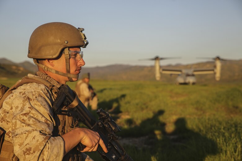 MARINE CORPS BASE CAMP PENDLETON, Calif. – A Marine with the 15th Marine Expeditionary Unit Maritime Raid Force provides security for an MV-22 Osprey to land during an Interoperability Exercise on Camp Pendleton, Jan. 30, 2017. The Interoperability Exercise brings Marines from supporting units to begin training with the MRF for future operations. The 15th MEU’s amphibious force contains an extensive set of ship-to-shore connectors, by air or by sea, which allows the MEU to move people or equipment to any corner of the world necessary. (U.S. Marine Corps photo by Cpl. Timothy Valero)