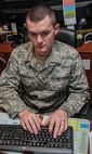 Tech Sgt. James Broderick, 791st Maintenance Squadron Missile Maintenance Operations Center controller, updates the integrated maintenance data system at Minot Air Force Base, N.D., Jan. 24, 2017. Airmen in the MMOC are responsible for assessing the operations of maintenance teams that are at missile sites in the field. (U.S. Air Force photo/Airman 1st Class Jonathan McElderry)
