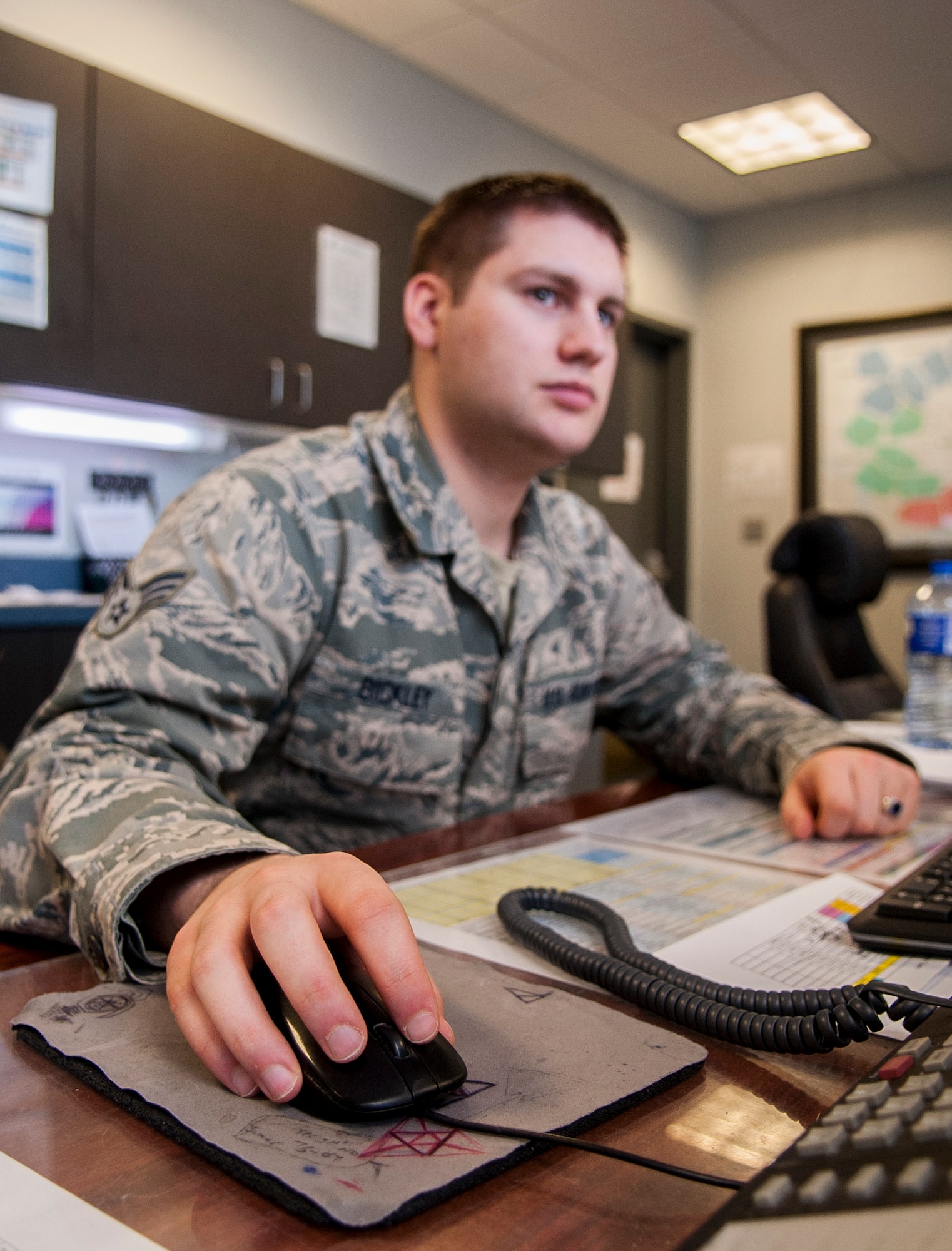 Senior Airman Matthew Bickley, 791st Maintenance Squadron Missile Maintenance Operations Center controller, updates a maintenance team’s information at Minot Air Force Base, N.D., Jan. 24, 2017. Airmen with the MMOC are responsible for annotating what maintenance teams are doing at the missile sites in the field. (U.S. Air Force photo/Airman 1st Class Jonathan McElderry)