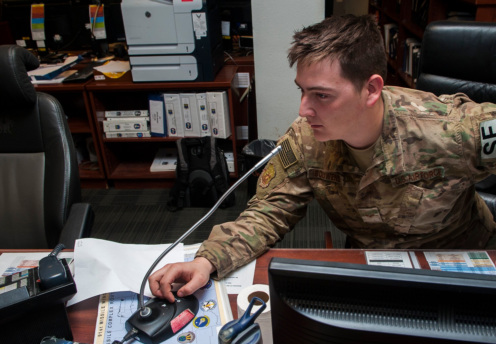 Senior Airman Caleb Bouwens, 91st Missile Security Forces Squadron transportation control functions controller, tracks road updates for government vehicles at Minot Air Force Base, N.D., Jan. 24, 2017. Airmen in the 91st Missile Maintenance Operations Center continuously keep track of all government vehicles at the missile field sites. (U.S. Air Force photo/Airman 1st Class Jonathan McElderry)