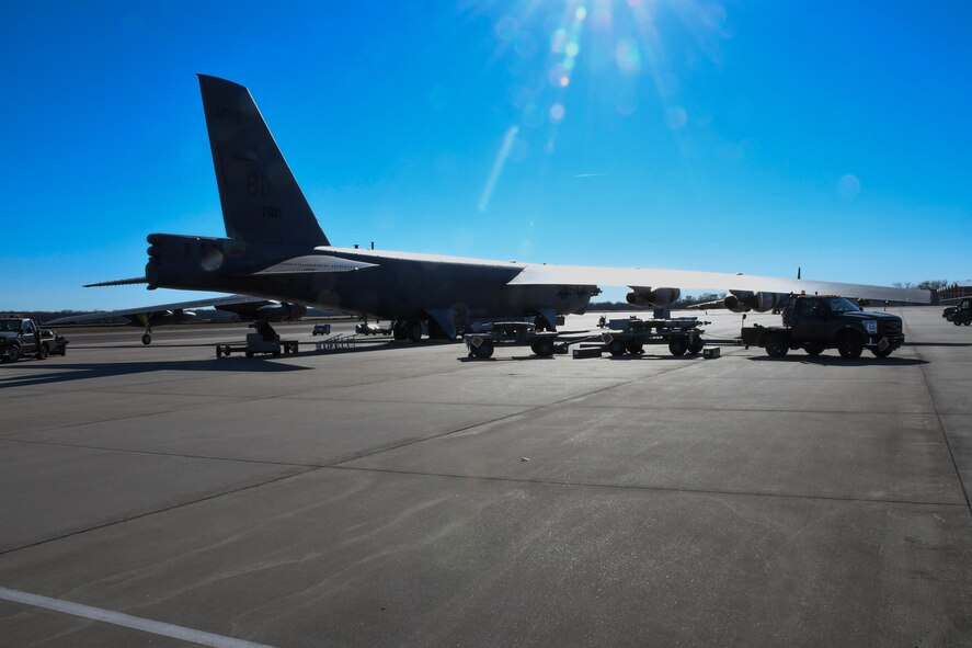 A B-52 Stratofortress awaits loading of live munitions onto its latest weapons system, the Conventional Rotary Launcher, at Barksdale Air Force Base, La., Feb. 1. 2017. The bombs loaded on the jet were part of the first live fire training mission for the CRL. The launcher can rotate through multiple types of munitions, allowing the jet to select the best munition to address a particular target. (U.S. Air Force photo by Tech. Sgt. Ted Daigle/released)