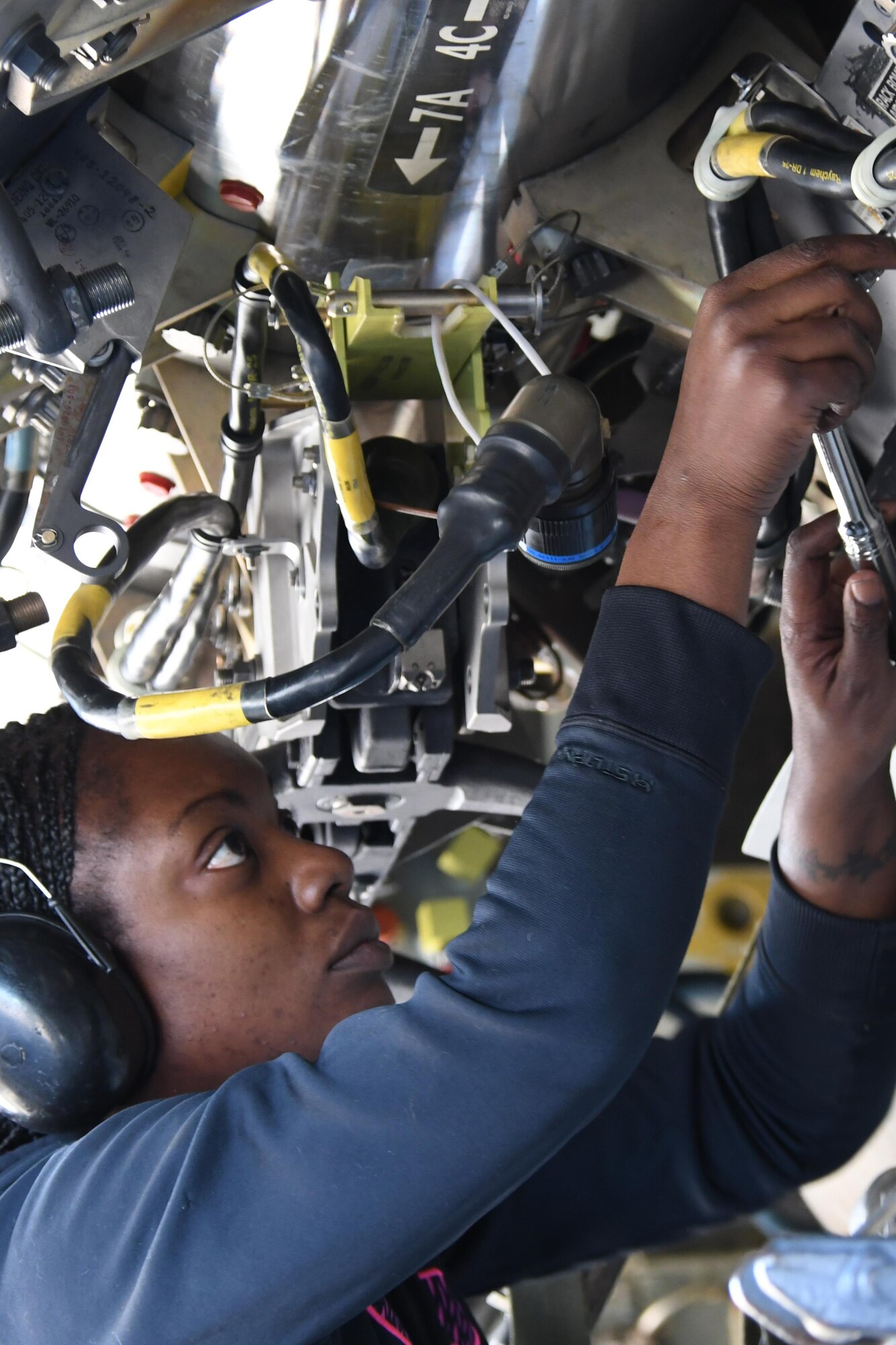 Master Sgt. Holly Guerra, 307th Aircraft Maintenance Squadron armament systems specialist, closes a bomb latching mechanism on a Conventional Rotary Launcher, at Barksdale Air Force Base, La., Feb. 1. 2017. The CRL can rotate through multiple types of munitions, allowing each B-52 to carry eight joint direct attack munitions internally, and eventual extended-range joint air-to-surface standoff missiles and miniature air-launched decoys. The CRL was being prepped to undergo its first live-fire training mission. (U.S. Air Force photo by Tech. Sgt. Ted Daigle/released)