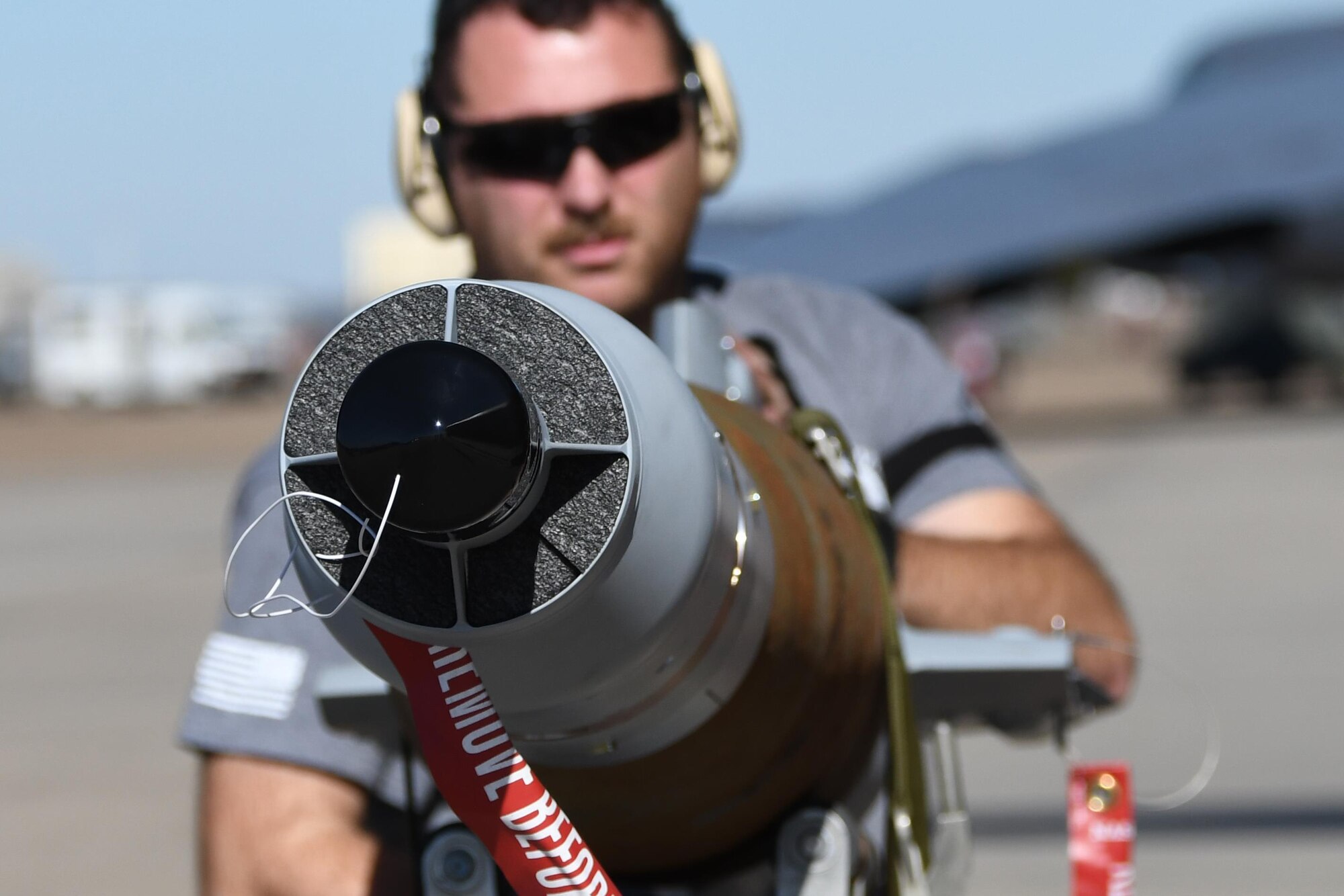 Tech. Sgt. Matt Gerrits, 307th Aircraft Maintenance Squadron armament systems specialist, prepares to load a guided bomb unit-12, at Barksdale Air Force Base, La., Feb. 1, 2017. The GBU-12 utilizes a Mk82 500-pound general purpose warhead with a computer control group at the front end and an airfoil group at the back. When a target is illuminated by a laser, either airborne or ground-based, the guidance fins react to signals from the control group and steer the weapon to the target. Wings on the airfoil group add the lift and aerodynamic stability necessary for in-flight maneuvering.  It was loaded in conjunction with other kinds of bombs on the Conventional Rotary Launcher.  The new launcher is capable of carrying several different types of munitions at one time.  The CRL was being prepped to undergo its first live-fire training mission. (U.S. Air Force photo by Tech. Sgt. Ted Daigle/released)