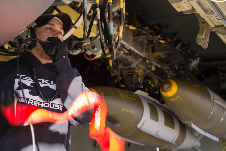 Staff Sgt. Joshua Amburn, 307th Aircraft Maintenance Squadron armament systems specialist, tests a Conventional Rotary Launcher on a B-52 Stratofortress at Barksdale Air Force Base, La., Feb. 1, 2017. The bombs loaded on the jet were part of the first live fire training mission for the CRL. The CRL can rotate through multiple types of munitions, giving B-52 crews greater flexibility in addressing targets during a mission. (U.S. Air Force photo by Staff Sgt. Jason McCasland/released)