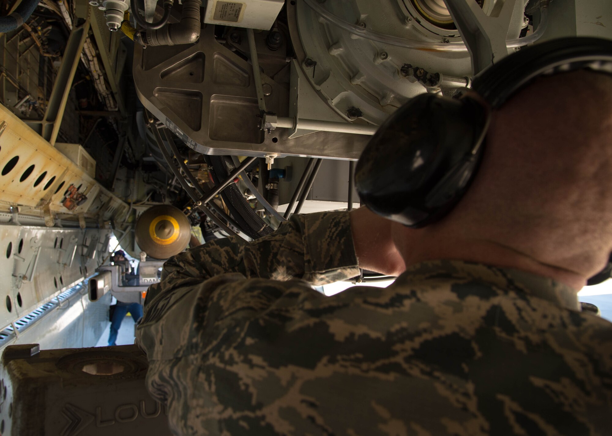 An Airman spots the placement of munitions on a Conventional Rotary Launcher at Barksdale Air Force Base, La., Feb. 1, 2017. The new launcher rotates in the bomb bay of a B-52 Stratofortress and can hold multiple types of munitions. This allows the bomber crew to select the most appropriate munition for a selected target during a mission. The CRL underwent live fire testing on Feb. 2, 2017. (U.S. Air Force photo by Staff Sgt. Jason McCasland/Released)