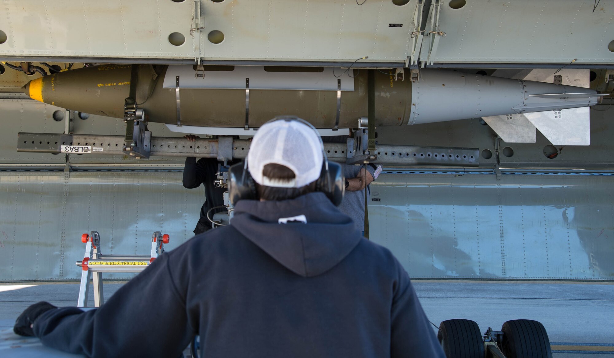U.S. Air Force Staff Sgt. Joshua Amburn, 307th Aircraft Maintenance Squadron armament systems mechanic, loads a 2000 pound Joint Direct Attack Munition onto a Conventional Rotary Launcher at Barksdale Air Force Base, La., Feb. 1, 2017. The launcher is a new weapons system for the B-52 Stratofortress and can hold several different types of munitions, giving greater mission flexibility when engaging targets. (U.S. Air Force photo by Staff Sgt. Jason McCasland/Released)