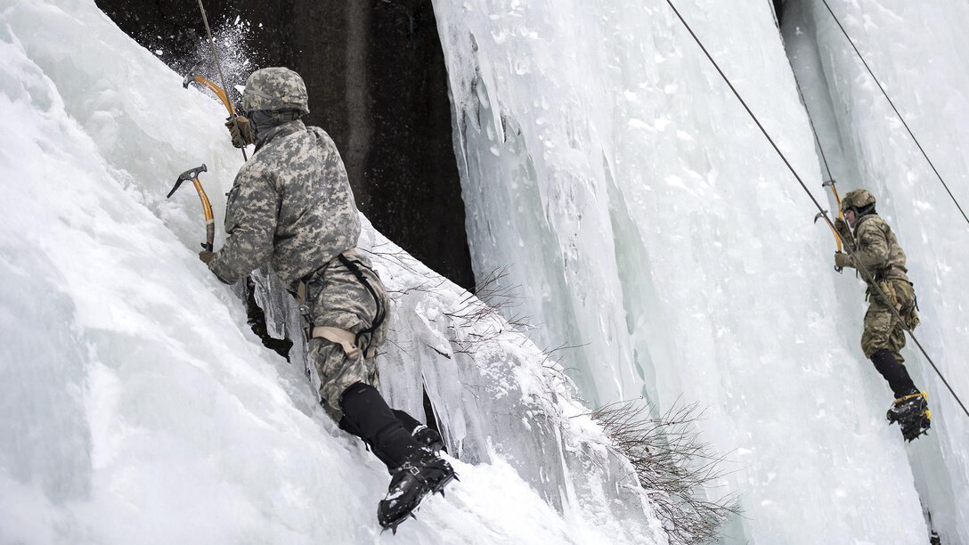 Soldiers climb an ice-covered cliff at Smugglers' Notch in Jeffersonville, Vt., Jan. 28, 2017. The soldiers are assigned to the Army National Guard. Air National Guard photo by Tech. Sgt. Sarah Mattison