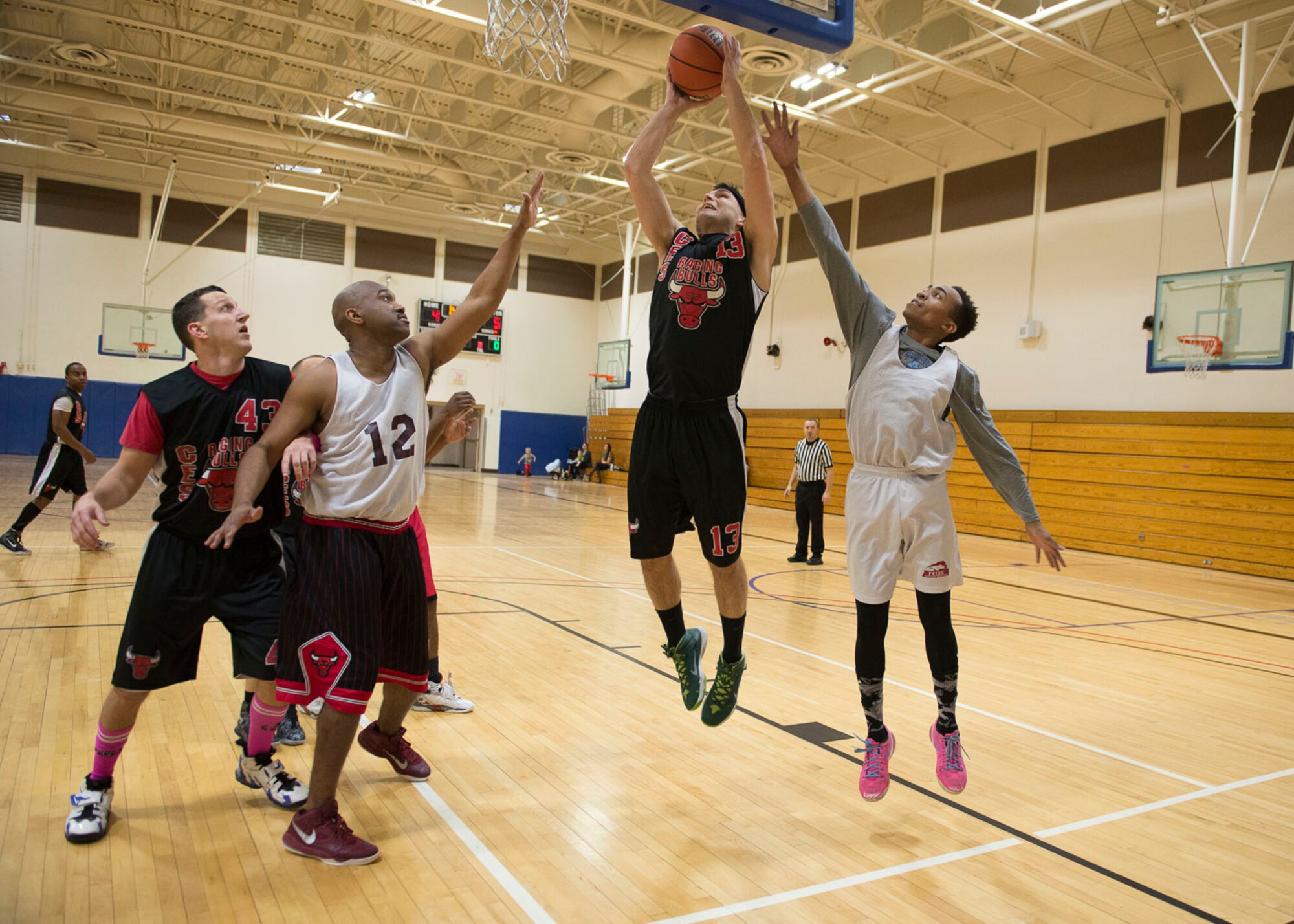 Tyler Ford, Civil Engineer Squadron forward, rises up for a shot during the Intramural Basketball Championship game, Jan. 30, at Mountain Home Air Force Base, Idaho. Ford, along with Kyle Durbin, led the Civil Engineer Squadron with 13 points apiece.