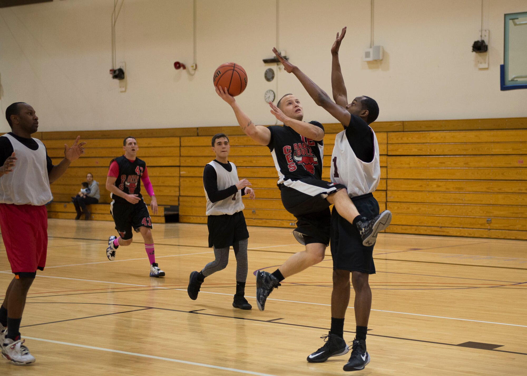 Kyle Durbin, Civil Engineer Squadron point guard, attempts a shot during the Intramural Basketball Championship game, Jan. 30, at Mountain Home Air Force Base, Idaho. Ford along with Kyle Durbin led the Civil Engineer Squadron with 13 points apiece.
