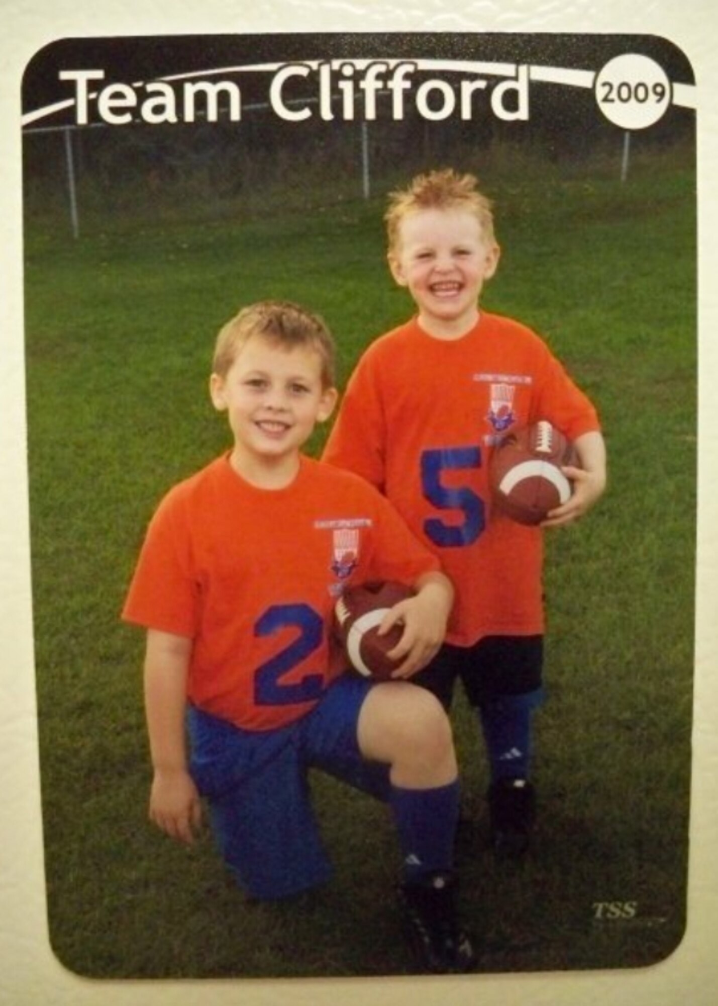 Gavin and Ethan Clifford, the sons of Joshua and Monica Clifford, both from the 354th Comptroller Squadron, pose for their football photo in the fall of 2009. The Clifford boys love to participate in and watch various sports and have a Fantasy Football league with their mom and dad. (Courtesy photo)