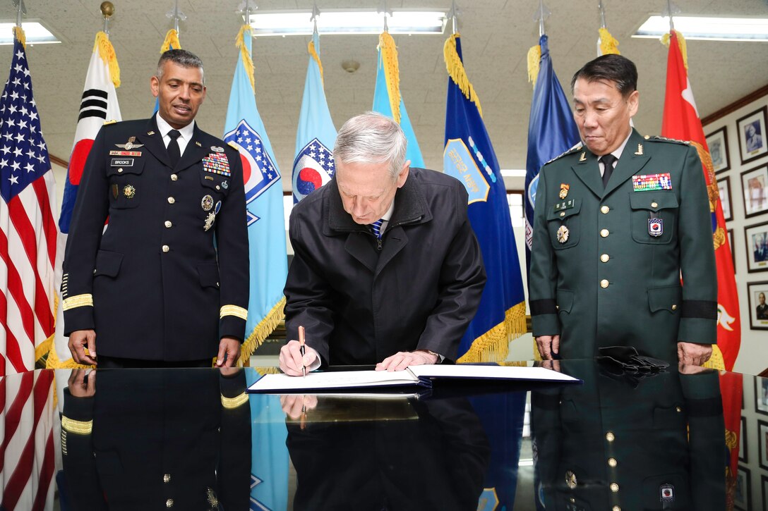 United States Forces Korea Commander, U.S. Army Gen. Vincent K. Brooks (left) and Deputy Commander, Combined Force Command, Ger. Leem Ho-young (right) watch as U.S. Defense Secretary Jim Mattis signs the guest book at the U.S. Forces Headquarters, U.S. Army Garrison Yongsan, Republic of Korea, Feb. 2, 2017. The importance of the Asia-Pacific region sends a vital message that the U.S.  seeks to further enhance collaboration and cooperation in the region and that the U.S. stands firmly with its allies in the face of common threats, such as those posed by North Korea.

