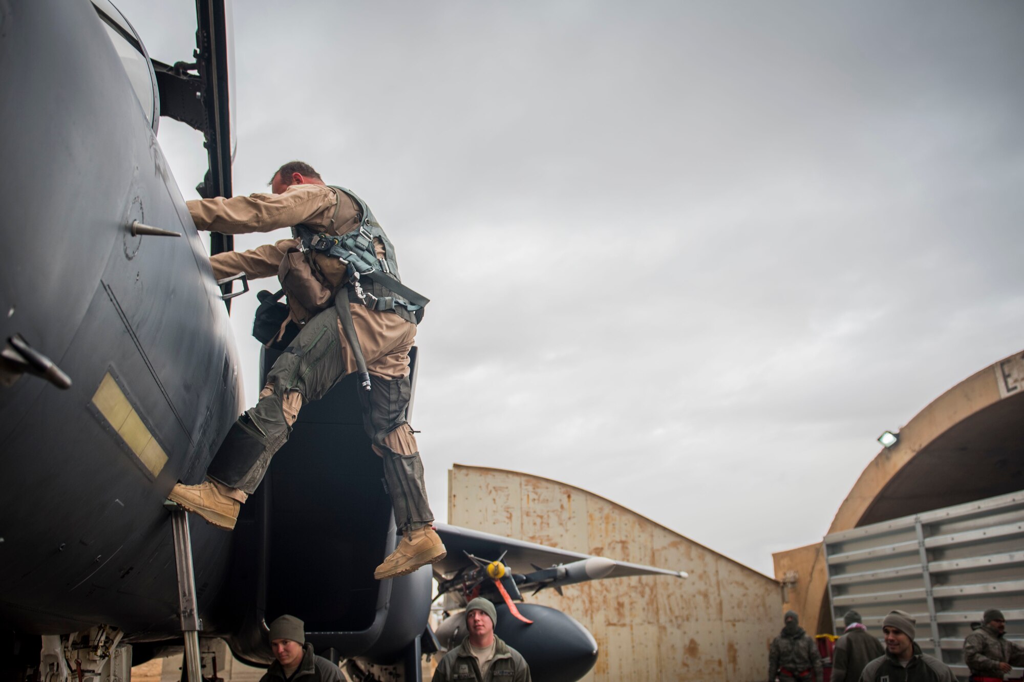 U. S. Air Force Col. David Brynteson, 332nd Expeditionary Operations Group commander, debarks his aircraft after his fini flight, Jan. 27, 2016, in Southwest Asia. Brynteson has been commanding here for four months leading combat operations in the area of responsibility. (U.S. Air Force photo by Staff Sgt. Eboni Reams)