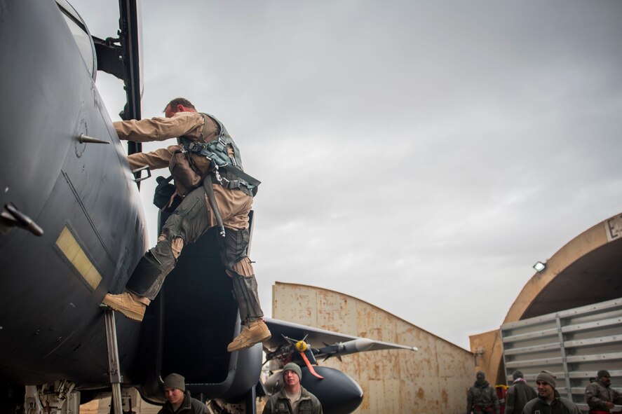 U. S. Air Force Col. David Brynteson, 332nd Expeditionary Operations Group commander, debarks his aircraft after his fini flight, Jan. 27, 2017, in Southwest Asia. Brynteson has been commanding here for four months leading combat operations in the area of responsibility. (U.S. Air Force photo by Staff Sgt. Eboni Reams)
