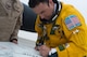 Maj. Ryan, a U-2 pilot, signs a mural created in celebration of a U-2 airframe achieving a 30,000 flight hours at an undisclosed location in Southwest Asia, Feb. 2, 2017. This marked the second U-2 in the USAF fleet to reach the milestone and the first overall while flying expeditionary missions under Air Force Central Command. (U.S. Air Force photo/Senior Airman Tyler Woodward)
