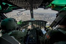 459th Airlift Squadron UH-1N Iroquois pilots point out Tokyo landmarks to participants of a Yokota Air Base Spouse Orientation Flight Feb. 1, 2017, near Tokyo, Japan. Participants who flew in a UH-1N were given an aerial tour of down town Tokyo. (U.S. Air Force photo by Airman 1st Class Donald Hudson)