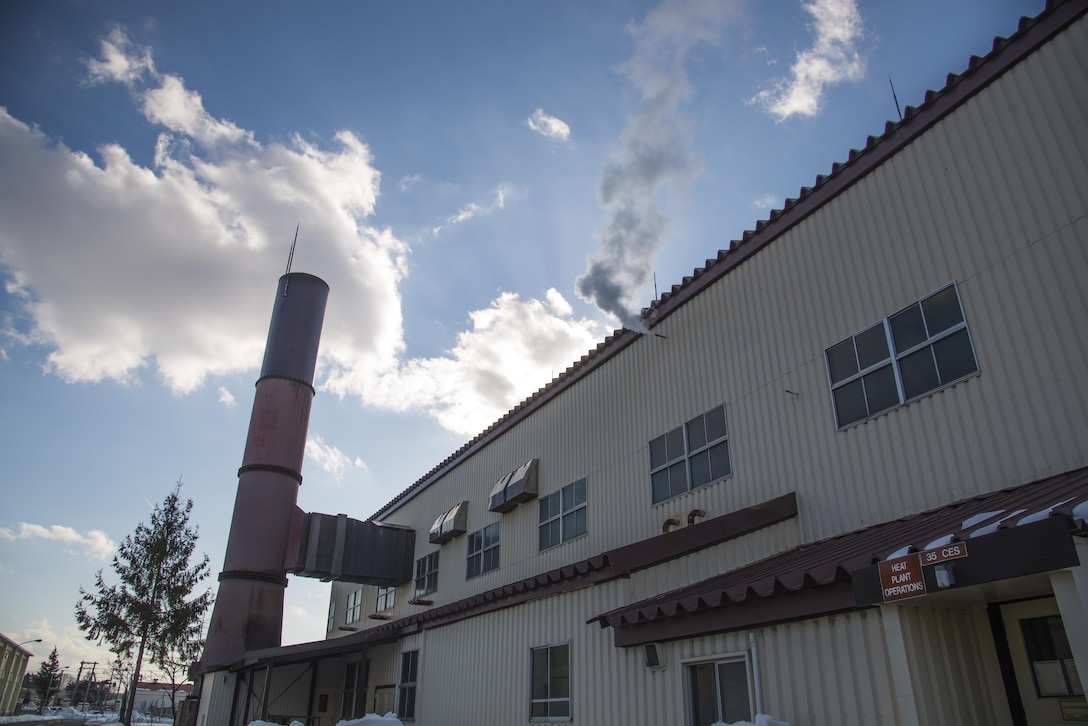 A building releases steam at Misawa Air Base, Japan, Jan. 26, 2017. In order to provide heat to several buildings, water is sent to boilers which vaporize and go through several pipes throughout the base. Once the steam reaches a building, it goes through a compactor, separating the heat from the water and blowing it into the rooms. (U.S. Air Force photo by Airman 1st Class Sadie Colbert)