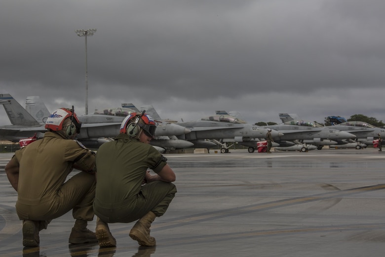 U.S. Marines with Marine All Weather Fighter Attack Squadron (VMFA) 225 wait to direct F/A-18D Hornets during exercise Cope North at Andersen Air Force Base, Guam, Feb. 3, 2017. Marines trained with the Royal Australian Air Force and Japan Air Self-Defense Force supporting theater security, focusing on dissimilar air combat training and large force employment. (U.S. Marine Corps photo by Cpl. Nathan Wicks)
