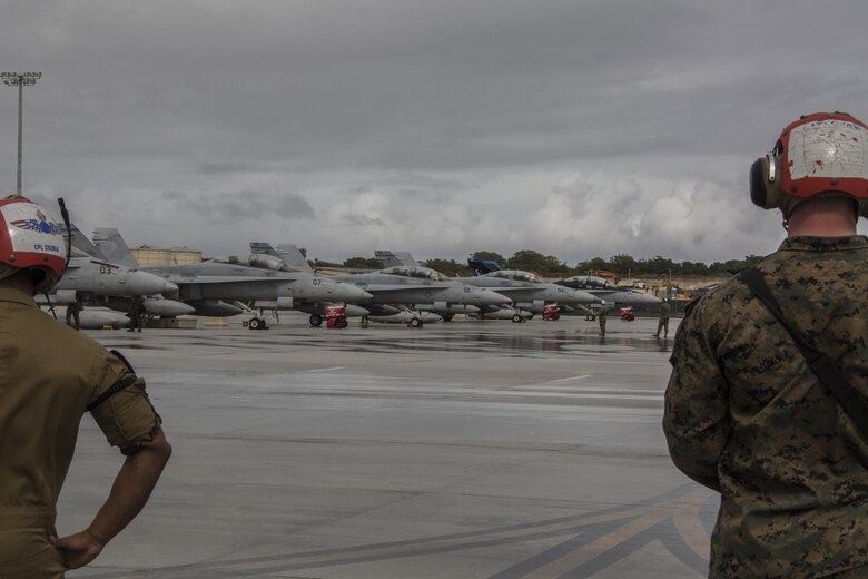 U.S. Marines with Marine All Weather Fighter Attack Squadron (VMFA) 225 wait to direct F/A-18D Hornets during exercise Cope North at Andersen Air Force Base, Guam, Feb. 3, 2017. Marines trained with the Royal Australian Air Force and Japan Air Self-Defense Force supporting theater security, focusing on dissimilar air combat training and large force employment. (U.S. Marine Corps photo by Cpl. Nathan Wicks)
