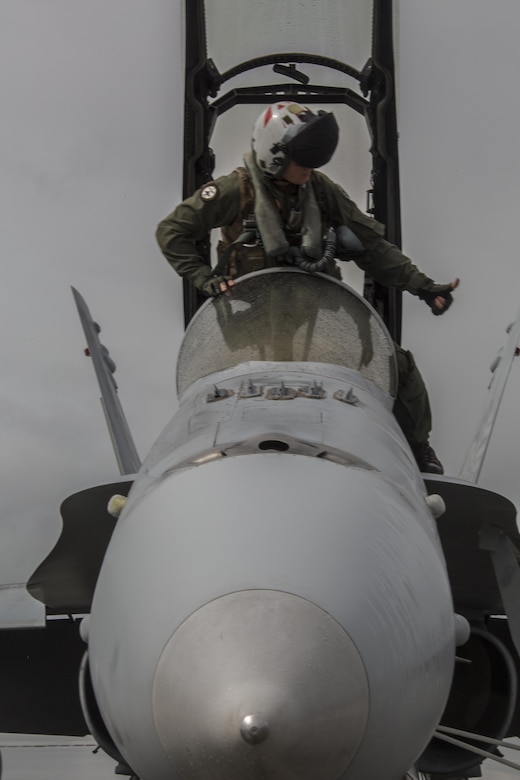 A U.S. Marine Corps pilot with Marine All Weather Fighter Attack Squadron (VMFA) 225 gives the thumbs up as he prepares to man an F/A-18D Hornet during exercise Cope North  at Andersen Air Force Base, Guam, Feb. 3, 2017. Marines trained with the Royal Australian Air Force and Japan Air Self-Defense Force supporting theater security, focusing on dissimilar air combat training and large force employment. (U.S. Marine Corps photo by Cpl. Nathan Wicks)