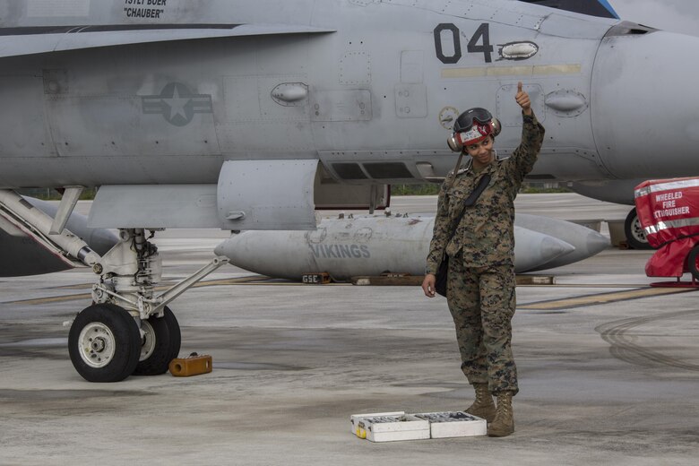 A U.S. Marine with Marine All Weather Fighter Attack Squadron (VMFA) 225 gives the thumbs up after inspecting an F/A-18D Hornet during exercise Cope North at Andersen Air Force Base, Guam, Feb. 3, 2017. The Marines inspect the aircraft prior to take off to ensure it is fit for flight. Marines trained with the Royal Australian Air Force and Japan Air Self-Defense Force supporting theater security, focusing on dissimilar air combat training and large force employment. (U.S. Marine Corps photo by Cpl. Nathan Wicks)