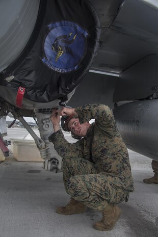 A U.S. Marine with Marine All Weather Fighter Attack Squadron (VMFA) 225 inspects an F/A-18D Hornet during exercise Cope North at Andersen Air Force Base, Guam, Feb. 3, 2017. The Marines inspect the aircraft prior to take off to ensure it is fit for flight. Marines trained with the Royal Australian Air Force and Japan Air Self-Defense Force supporting theater security, focusing on dissimilar air combat training and large force employment. (U.S. Marine Corps photo by Cpl. Nathan Wicks)