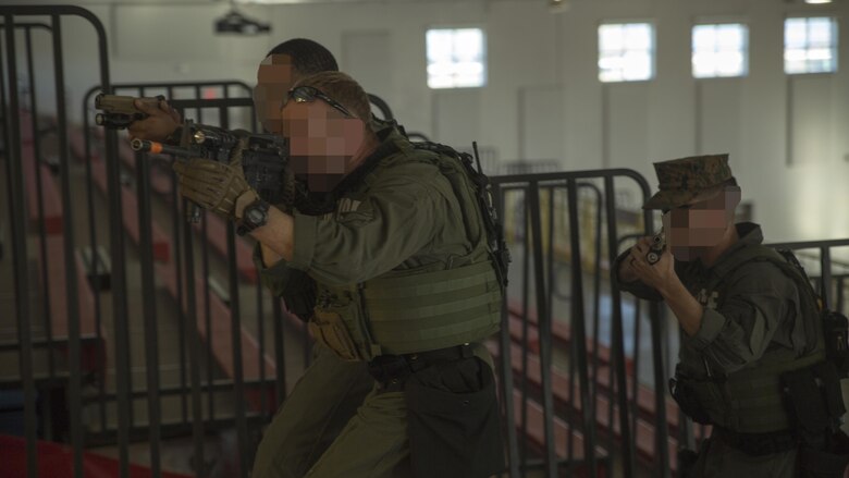 Members of the Special Response Team search for a suspect during an anti-terrorism/force protection exercise on Parris Island, S.C., Feb. 2, 2017. The exercise simulated an active shooter and hostage situation and was designed to test various aspects of the depot’s emergency response capabilities. (NOTE: Faces of certain personnel have been blurred to protect their identity.)