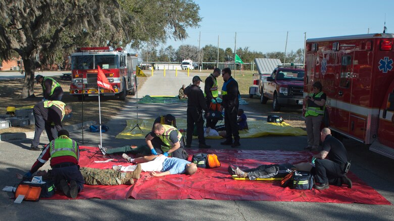 Members of Parris Island Fire and Rescue provide emergency care to casualties during an anti-terrorism/force protection exercise Feb. 2, 2017. The exercise simulated an active shooter and hostage situation and was designed to test various aspects of the depot’s emergency response capabilities.