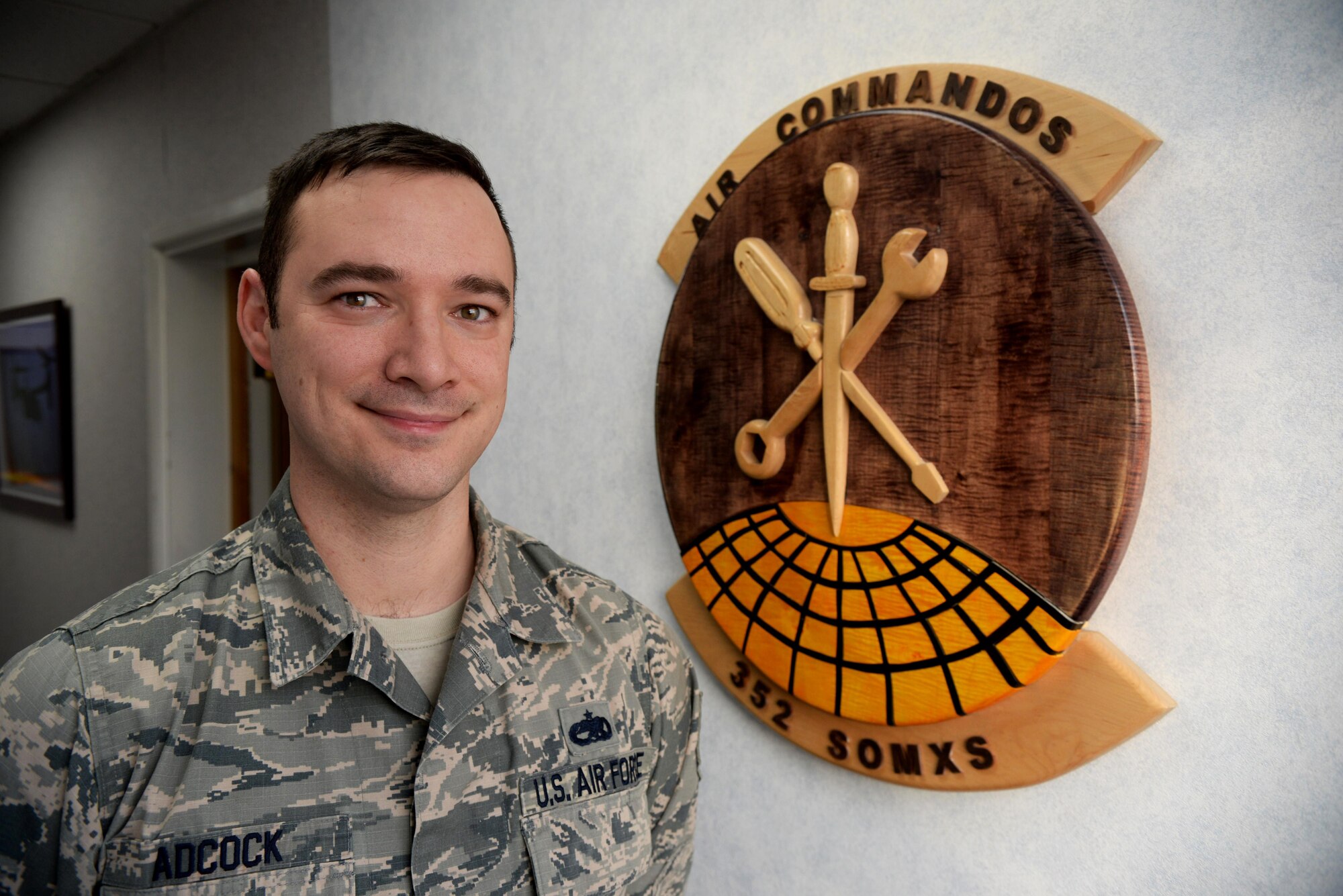 U.S. Air Force Tech. Sgt. Brian Adcock, 352nd Special Operations Maintenance Squadron resource advisor, poses for a photograph in his work center Feb. 2, 2017, on RAF Mildenhall, England. Adcock was selected as the Mildenhall Nation honoree this week for showing excellence in and out of the workplace. (U.S. Air Force photo by Airman 1st Class Tenley Long)
