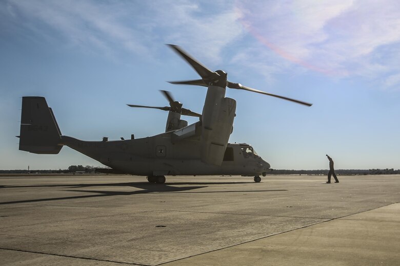 MARINE CORPS AIR STATION NEW RIVER, N.C.—Lance Cpl. Luke Peters directs an MV-22B Block C Osprey after it landed aboard MCAS New River, N.C., Feb. 1, 2017. This is the first time the training squadron has received a brand-new, straight from the factory aircraft. The MV-22B Block C incorporates weather radar; an improved environmental control system; troop commander situational awareness display; upgraded standby flight instrument and GPS; and additional chaff/flare equipment. Block C development first began in 2006. Peters is a crew chief with Marine Medium Tiltrotor Training Squadron 204.(U.S. Marine Corps photo by Lance Cpl. Miranda Faughn/Released)