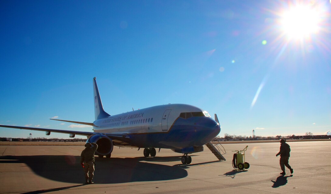 Executing the mission:  932nd Airlift Wing's Maintenance Group (MXG), is responsible for leading people who are always training and equipping Airmen to inspect, maintain and repair Air Force Reserve Command C-40C planes at Scott Air Force Base. The 932nd MXG's management of resources improves the wing's professionalism and enables the 932nd Operations Group's C-40C aircraft to fly distinguished visitor (DV) airlift around the world where needed by the nation's leaders. Here, two maintainers make a last minute checks on the plane before it leaves on a cold January 4, 2017 day. The Illinois unit, which is part of 22nd Air Force, under Air Force Reserve Command, flies four of the C-40C planes. (U.S. Air Force photo by Lt. Col. Stan Paregien)