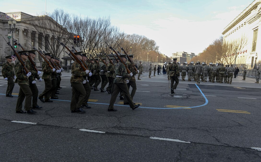 The United States Marine Corps Honor Guard march on Pennsylvania Avenue during the Department of Defense dress rehearsal in Washington D.C., Jan. 15, 2017. More than 5,000 military members from across all branches of the armed forces of the United States, including Reserve and National Guard components, provided ceremonial support and Defense Support of Civil Authorities during the inaugural period. (DoD photo by U.S. Air Force Senior Airman Keith James)