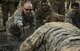 Lt. Col. Christopher Anderson, the 1st Combat Camera Squadron commander, reaches to assist a combat camera Airman during an obstacle course at the U.S. Army Training Center in Fort Jackson, S.C., Jan. 29, 2017. Exercise Scorpion Lens is an annual ‘ability to survive and operate’ training exercise mandated by Air Force Combat Camera job qualification standards. The exercise’s purpose is to provide refresher training to combat camera personnel in the areas of combat tactics, photography, videography and on procedures inherent to support combat camera mission tasks. (U.S. Air Force photo/Airman 1st Class James R. Crow)
