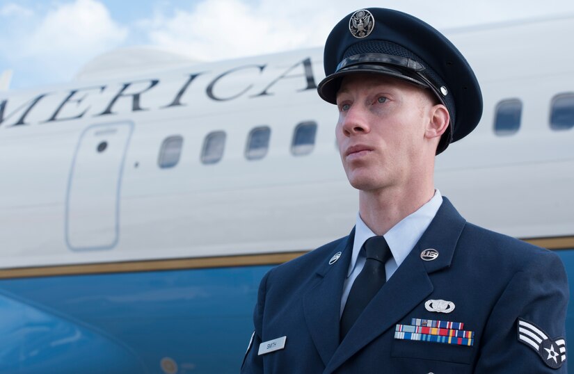 Senior Airman Joshua D. Smith, 811th Security Forces Squadron executive aircraft security team member, stands in front a Boeing C-32, at Joint Base Andrews, Md., Jan. 26, 2017. Smith provides discrete, low‐visibility security for the protection of Air Force aircraft transiting between airfields. This job includes accompanying traveling individuals like the vice president, secretary of defense, secretary of state, and senate and cabinet members. (U.S. Air Force photo by Senior Airman Jordyn Fetter)