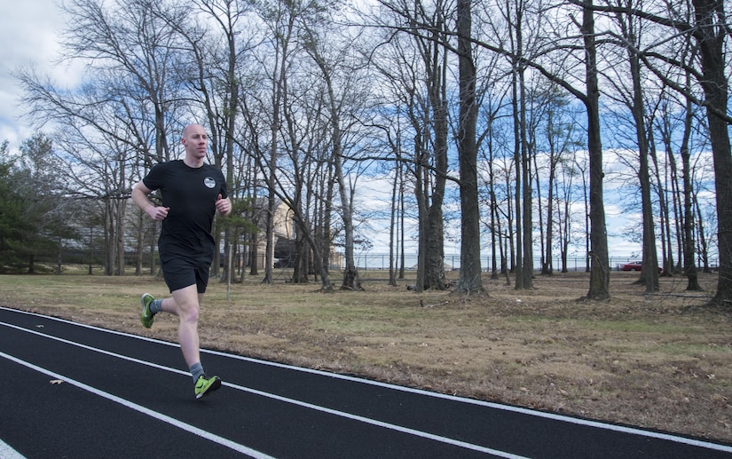 Senior Airman Joshua D. Smith, 811th Security Forces Squadron executive aircraft security team member, runs on a track at Joint Base Andrews, Md., Jan. 27, 2017. Smith is known as the “guy who runs” by his peers due to his love for running and completion of the Marine Corps marathon, five half marathons and numerous 5Ks. (U.S. Air Force photo by Senior Airman Jordyn Fetter)