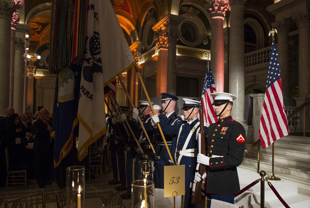 The Joint Armed Forces Color Guard presents the colors during the Cabinet Dinner at the Library of Congress in Washington D.C., Jan. 18, 2017. More than 5,000 military members from across all branches of the armed forces of the United States, including Reserve and National Guard components, provides ceremonial support and Defense Support of Civil Authorities during the inaugural period. (DoD photo by U.S. Air Force Senior Airman Keith James)