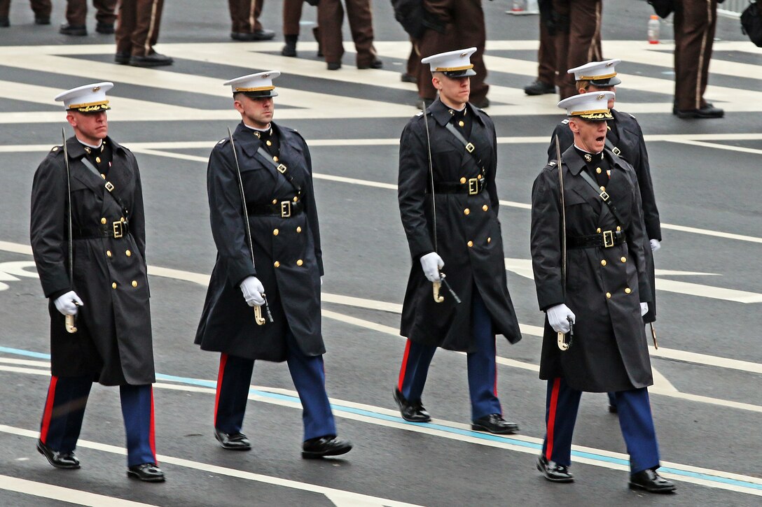 Marine Parade Staff element from Marine Barracks Washington march down Pennsylvania Avenue during the 58th Presidential Inauguration in Washington, D.C., Jan. 20, 2017. Military personnel assigned to Joint Task Force - National Capital Region provided military ceremonial support and Defense Support of Civil Authorities during the inaugural period. (DoD photo by U.S. Army Sgt. Paige Behringer)